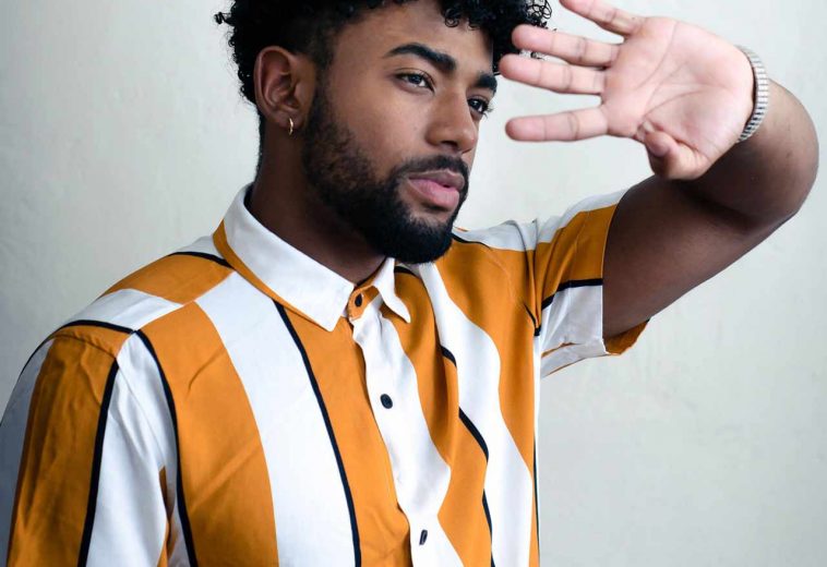 man-wearing-orange-and-white-striped-polo-shirt-3266352